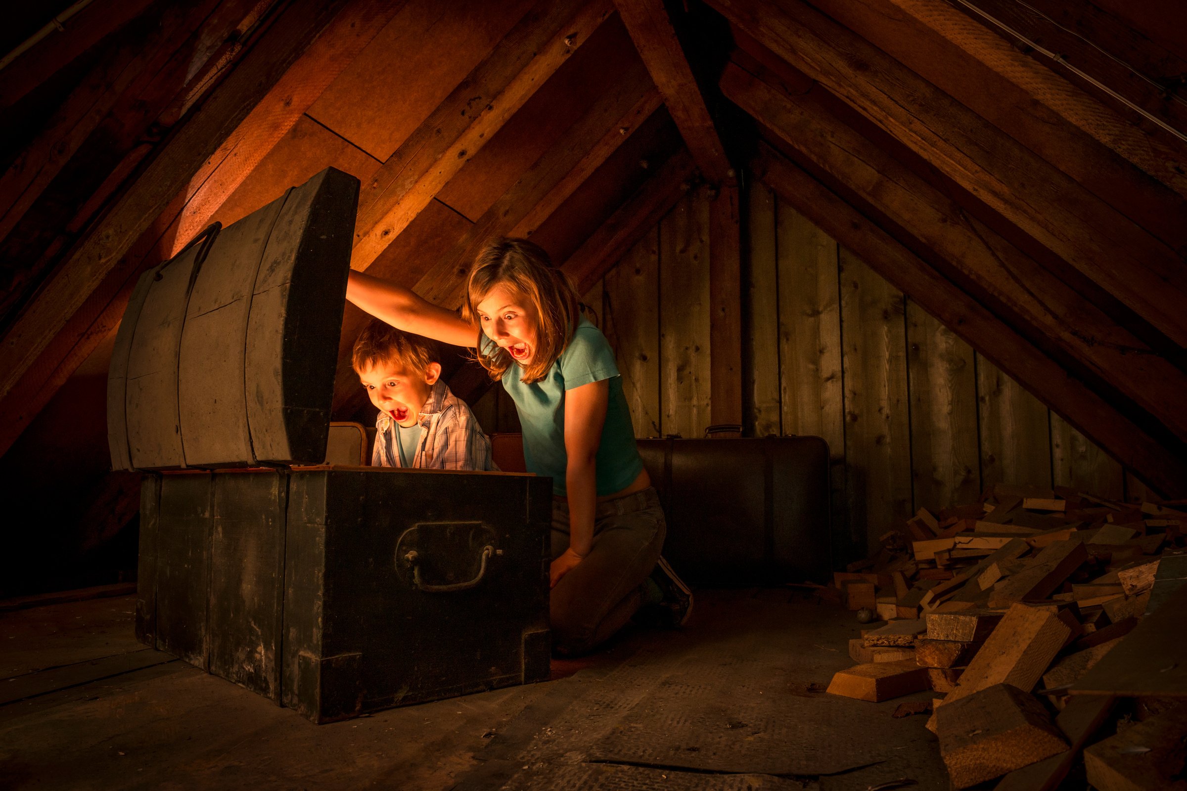 kids finding a treasure chest at the attic